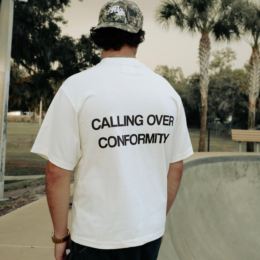 Calling Over Conformity Tee